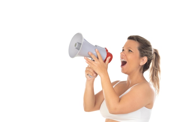 Young woman holding a megaphone and shouting