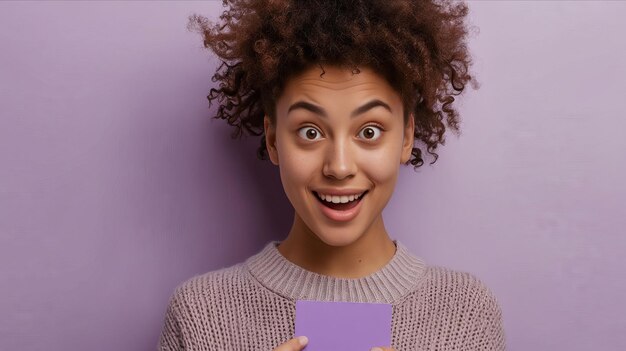 A young woman holding a purple card