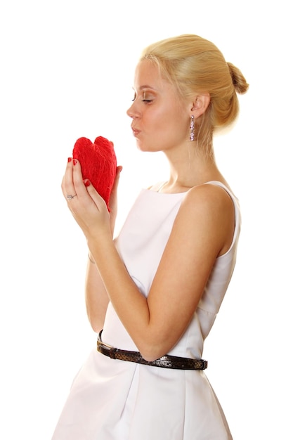 Young woman holding red heart