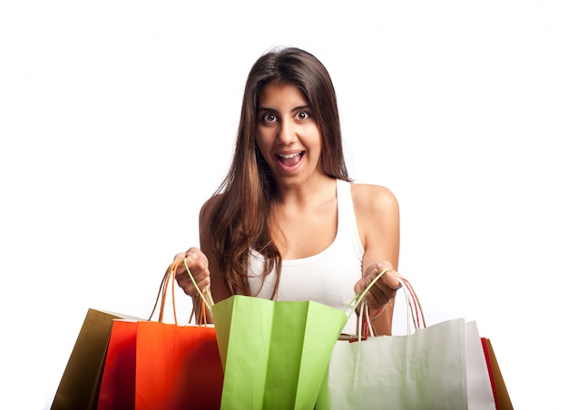 young woman holding shopping bags