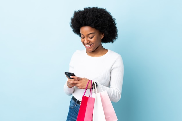 Young woman holding shopping bags