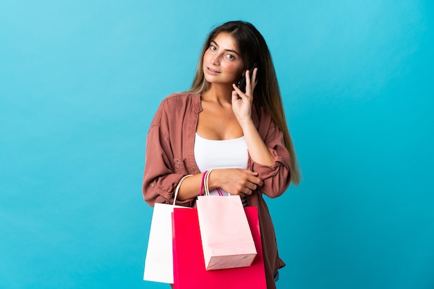 Young woman holding shopping bags