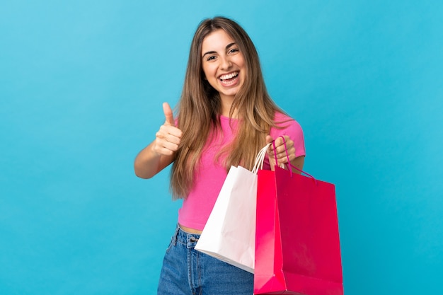 Young woman holding shopping bags