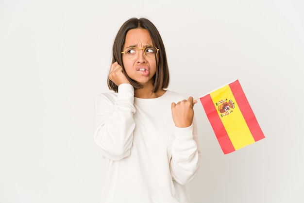 スペイン国旗を保持している若い女性