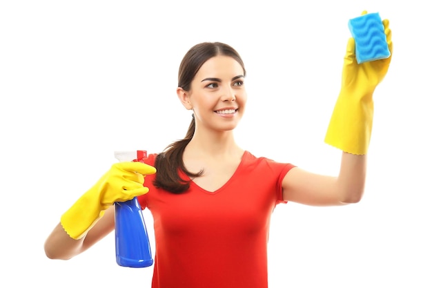 Young woman holding sponge and detergent spray isolated on white