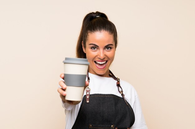 Young woman holding a take away coffee