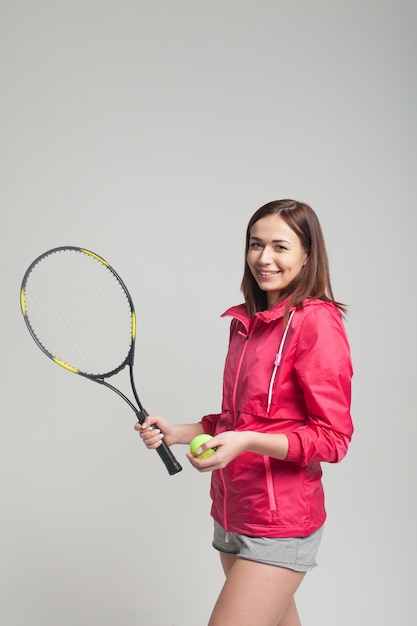 Young woman holding a tennis racket