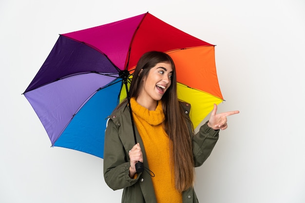 Young woman holding an umbrella isolated