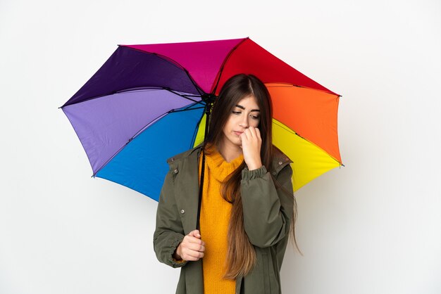 Young woman holding an umbrella isolated