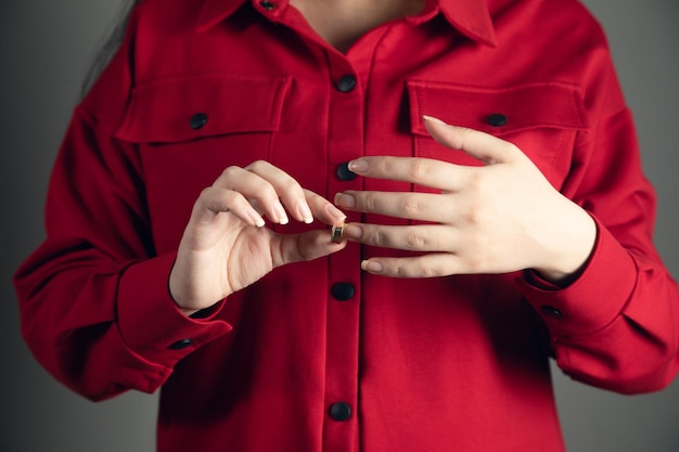 The young woman holding wedding ring