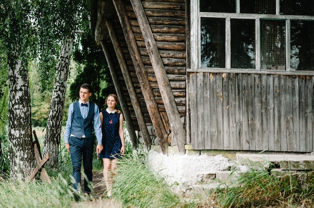 Young woman holds husband's hand