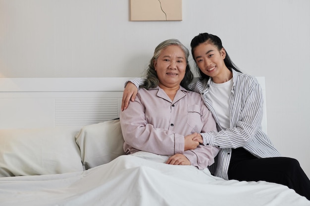 Young Woman Hugging Sick Mother