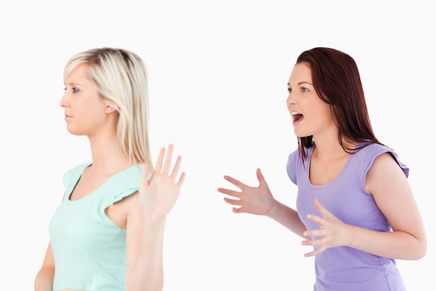 Young woman ignoring a yelling lady