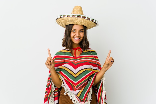 Young woman indicates with both forefingers up