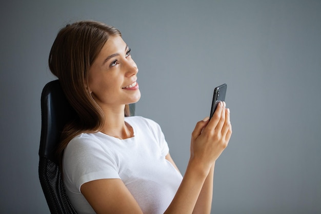 Young woman is addicted to the phone