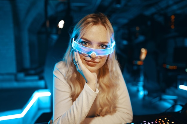 The young woman is all dressed in white and wearing neon glasses Neon style Portrait of a blonde in fashionable glasses