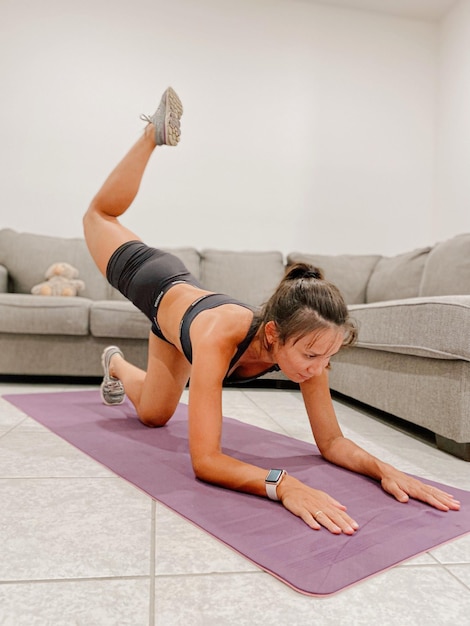 A young woman is making a fitness