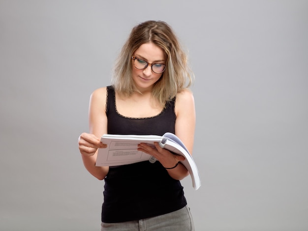 Young woman is reading a book