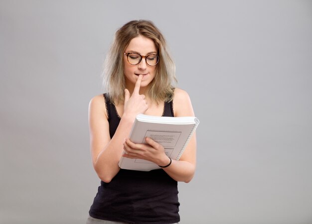 Young woman is reading a book