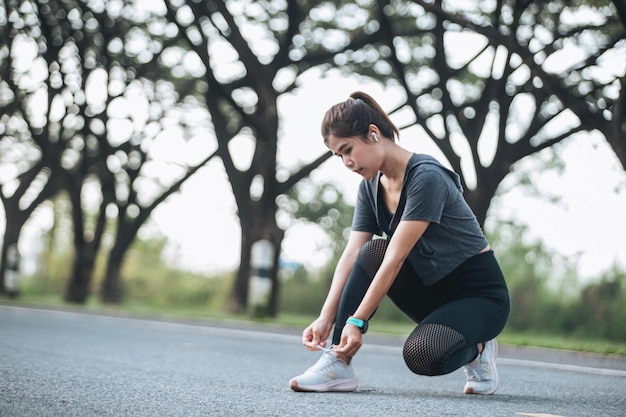 Young woman is running in sunny nature