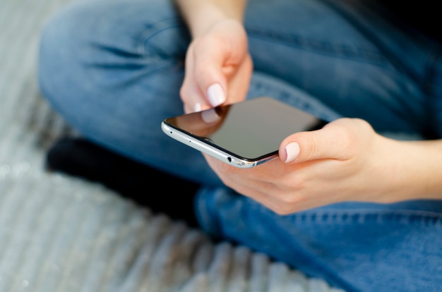 A young woman is using her mobile phone Communication at a distance