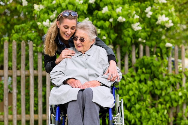 Young woman is visiting her grandmother in nursing home