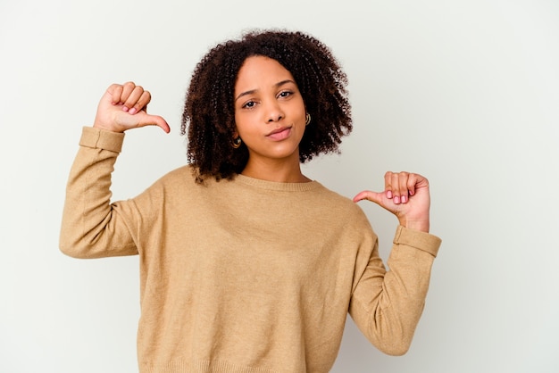 Young woman isolated feels proud and self confident, example to follow