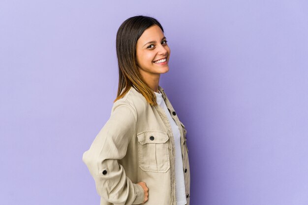 Young woman isolated on purple