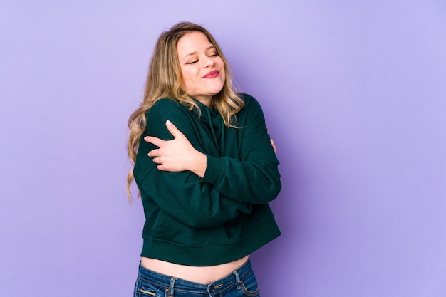 Young woman isolated on purple