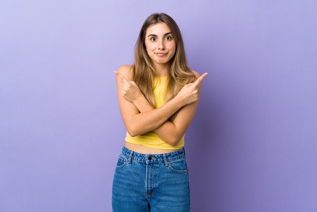 Young woman isolated on purple