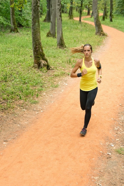 Young woman jogging in forest