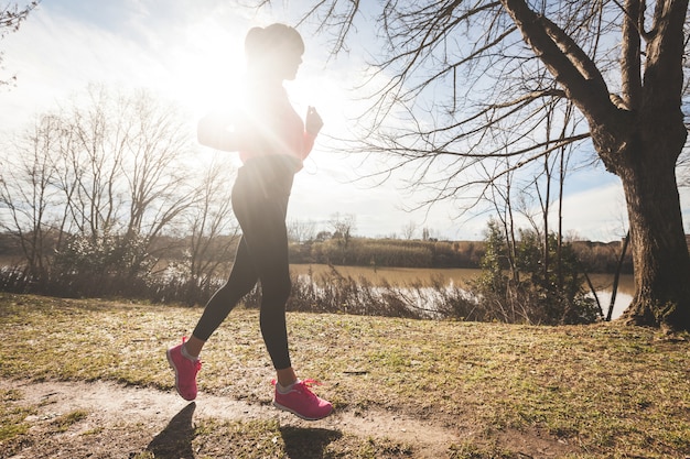 Young Woman Jogging on Off Road Path in the Morning.