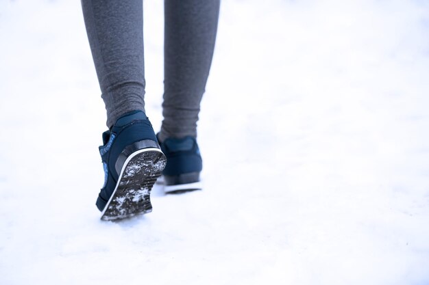 Young woman jogging in winter park