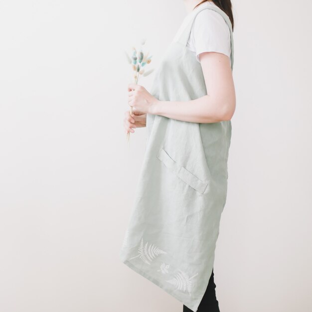 Young woman in a kitchen linen apron