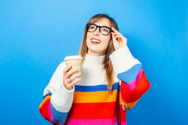 Young woman in a knitted sweater isolated