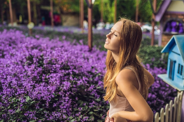 Young woman on lavender field. Lavender farm concept