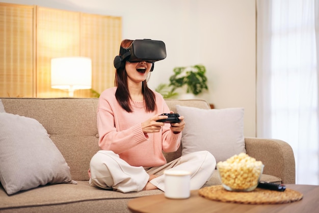 Young woman lesbian wearing sweater and VR goggles while holding