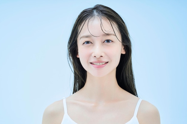 Young woman and light blue background