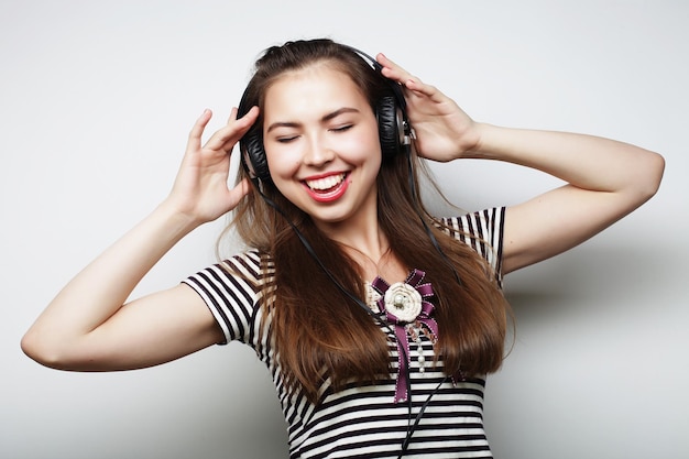 Young woman listening to music Happy and headphones Lifestyle concept