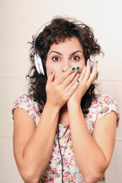 A young woman listening music with Headphones.