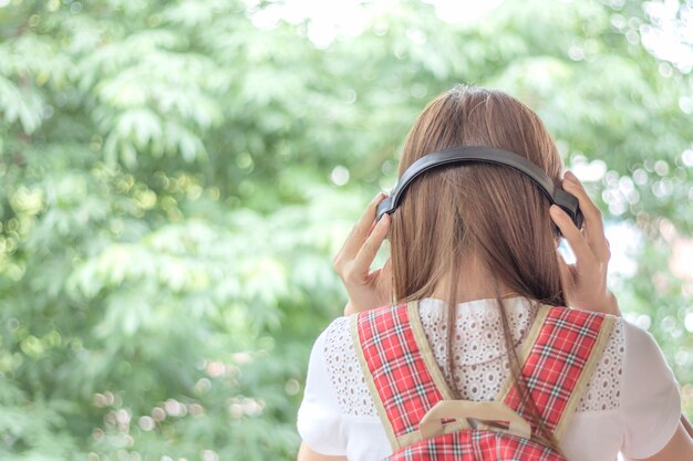 Young woman listening to music.