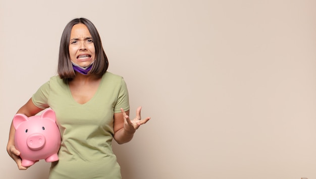 Young woman looking angry, annoyed and frustrated screaming wtf or whatâs wrong with you