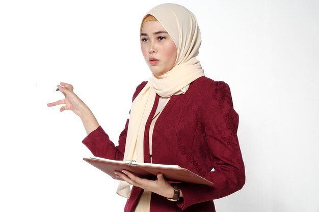 Young woman looking away against white background