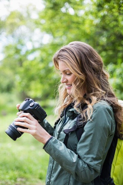 Young woman looking at camera in forest 