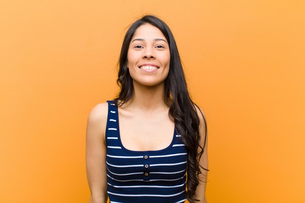 Young woman looking happy and goofy with a broad smile