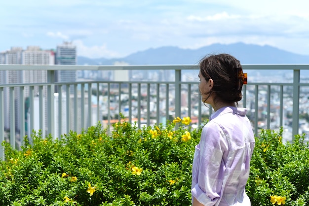 Young woman looking left on vietnamese city nha trang