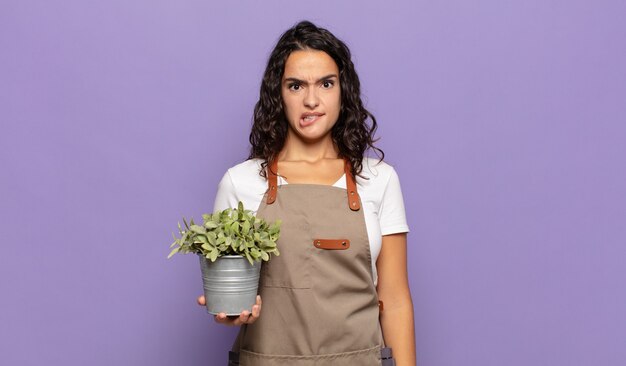 Young woman looking puzzled and confused