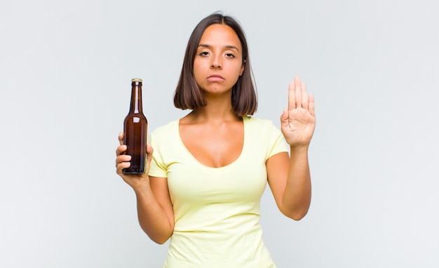 Young woman looking serious, stern