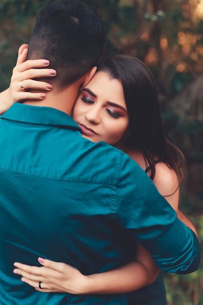 Young woman in love hugging her boyfriend