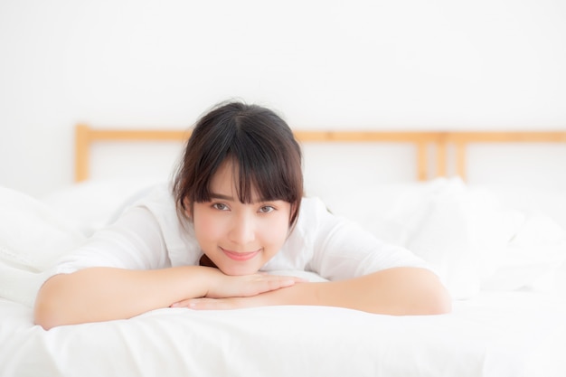 Young woman lying on a bed